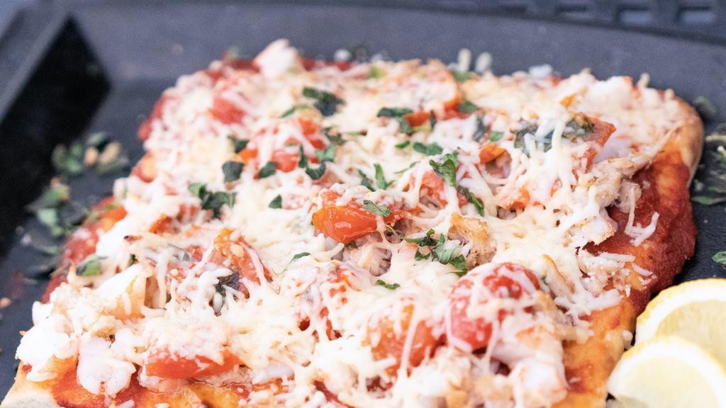 Seafood Lobster Pizza · Lobster and shrimps with basil and marinara sauce parmesan cheese garlic butter.