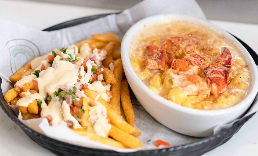 Lobster Mac And Cheese · - Real lobster meat with mac and cheese.
- With Jay’s special seasoning and cheese load  French fries.