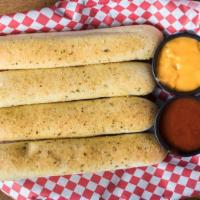 Soft Bread Sticks · Four soft bread sticks seasoned with our special garlic seasoning, topped with romano cheese...