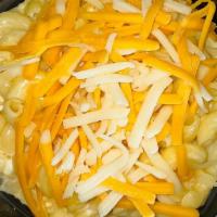Side Mac & Cheese · Mac and cheese topped with Cheddar.