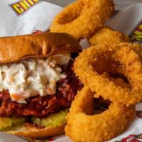 Nashville Hot Combo · Two hand breaded tenders topped with spicy seasoning, white BBQ sauce, creamy coleslaw, brio...
