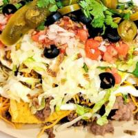 Taco Salad Supreme · Tortilla chips with your choice of meat (ground beef, turkey or chicken) choice of cheese; c...
