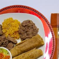 Tamale Dinner · 2 pork tamales with stew meat, rice and beans small salad. Add cheese or (wet) cheese for ad...