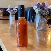 Honey Sriratcha Wing Sauce · Our Honey Sriracha Wing Sauce in a glass bottle. 

Ready to dip out of the bottle!

(we reco...