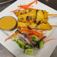 Satay (4) · Tender chicken marinated in coconut cream, madra curry, seasonings, and herbs then skewered ...