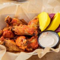 Wing Dings W/ House Buffalo And Blue Cheese Dressing · Tossed in buffalo sauce, blue cheese sauce for dippin'