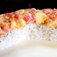 Volcano (8 Pieces) · California roll topped with tuna, red snapper, super white tuna mixed with spicy sauce.