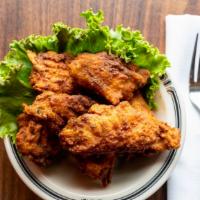 Seasoned Chicken Wings · Seven breaded wings with our secret spices.