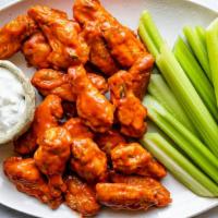 Hot Buffalo Wings · Spicy. One pound of wings served with celery and bleu cheese.