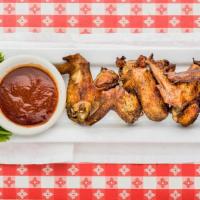 Smoked Whole Wings · Five mouth-watering jumbo wings pit smoked, served with sauce on the side.