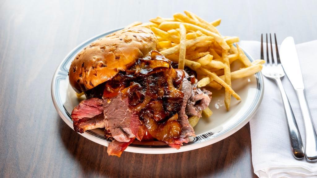 Bar-B-Que Beef Brisket Sandwich · Most popular. Sliced brisket is served on an onion bun, topped with BBQ sauce and caramelized onions. Our chopped brisket sandwich includes the burnt ends and is served on an onion bun and topped with BBQ sauce.
