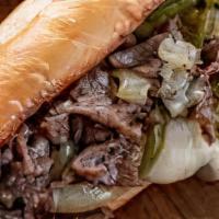 Philly Cheese Steak · Thinly sliced pieces of steak with melted jack cheese, and chopped bell peppers in a hoagie ...