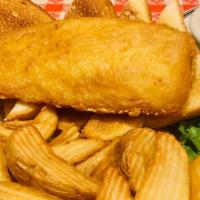 Fish & Chips · The Real Deal. A Beautiful Filet of Wild Alaskan ½ Pound Cod Served Over Wedge Cut Chips wit...