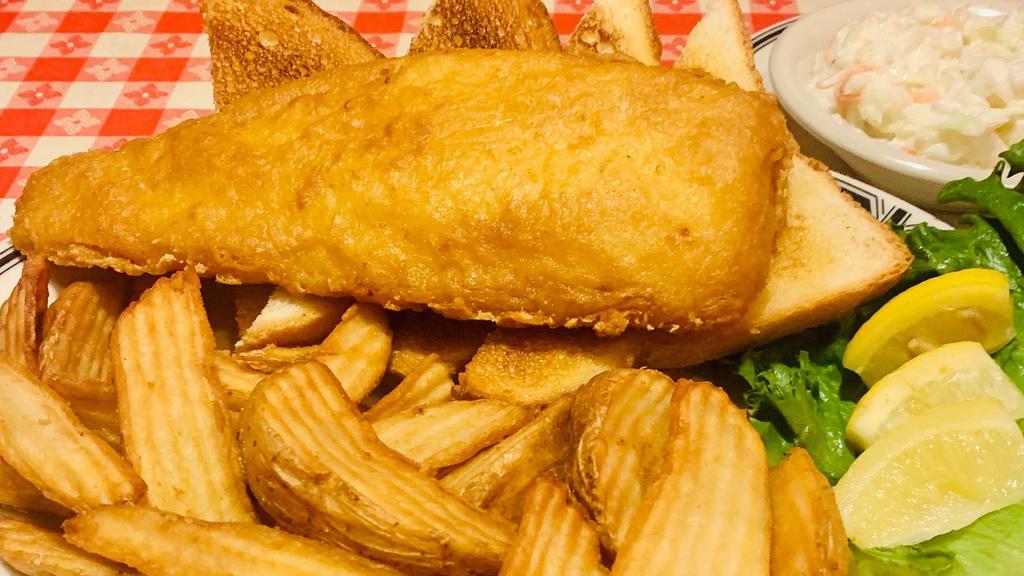 Fish & Chips · The Real Deal. A Beautiful Filet of Wild Alaskan ½ Pound Cod Served Over Wedge Cut Chips with Toast and Coleslaw.