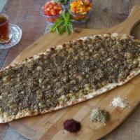 Long Zaatar Manaeesh (Vegan) · Lebanese long flatbread topped with zaatar (thyme) and toasted sesame seeds