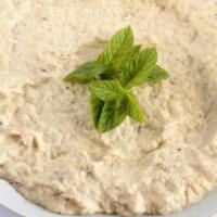 Baba Ganoush(Per Lb) (Vegan) · Delicious garlic baked eggplant puree mixed with tahini and drizzled with olive oil