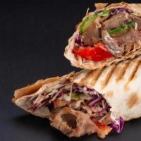 Beef Shawarma Sandwich · Beef shawarma marinated in a special blend of spices wrapped with pickles, turnips, tomatoes...