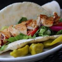Chicken Shawarma Sandwich · Chicken shawarma marinated in a special blend of spices wrapped with pickles, turnips, tomat...