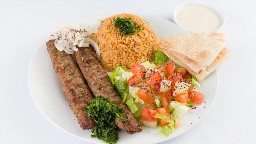 Kafta Kabob Plate · Juicy kafta kabob on skewers  served bread, pickles, and tahini sauce. Kafta is a traditional Lebanese beef kabob made with parsley, onions, and perfectly seasoned with cumin and allspice.. Small 2 skewers. Large 3 Skewers