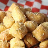 Beer Nuggets · Fried dough brushed with butter and parmesan cheese, served with marinara.
