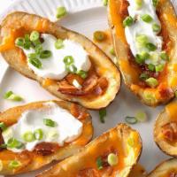 Idaho Potato Skins · Russet potato halves (4) topped with melted sharp cheddar cheese, chopped bacon, and scallio...