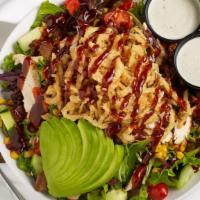 Bbq Chicken Salad · Crisp lettuce, broiled chicken breast, tomatoes, roasted corn, avocado, bacon, cucumbers, an...