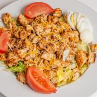 Chicken Salad · Large. Choice of grilled or crispy chicken, lettuce, tomatoes, hard boiled egg, Swiss and Am...