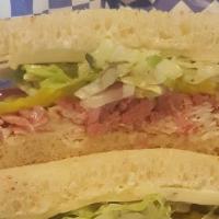 Dalek Delight · Turkey, roast beef, Pepper Jack cheese with dill pickles, red onion, shredded lettuce, herbe...