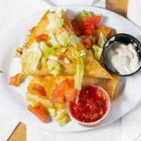Chicken Quesadilla · Grilled flour tortilla filled with blended cheeses and juicy grilled chicken. Served with a ...