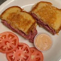 Reuben Sandwich · Corned beef with sauerkraut and swiss cheese. Come with chips and soup.