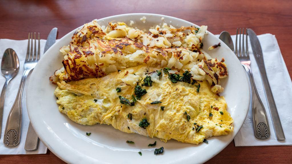 Spinach Omelette · With feta or swiss cheese. Prepared with 3 country fresh xl eggs and served with hash browns, grits, pancakes or tomato slices.