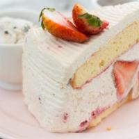 Strawberries & Cream · Sweet cream decked with fresh strawberries, sliced almonds, whipped cream and tasteful straw...