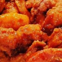 10 Wings With Fries · Cooked wing of a chicken coated in sauce or seasoning.