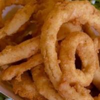 Onion Rings · Fresh Hand cut and breaded Onion Rings served with our homemade remoulade sauce