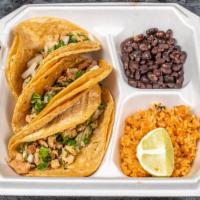 Cena De Taco De Pollo / Chicken Taco Dinner · Incluye 3 tacos servidos con arroz, frijoles y ensalada. / Includes 3 tacos served with a si...