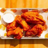 6 Buffalo Wings · gluten free. our take on traditional hot wings. served with housemade Bleu Cheese Dip.