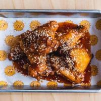6 Honey Sriracha Wings · gluten free. tossed in our honey siracha sauce topped with sesame seeds