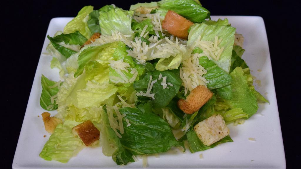 Caesar Salad · Chopped Romaine Lettuce, Shredded Parmesan, House Made Croutons.
