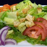 Garden Salad · Chopped Romaine Lettuce, Roma Tomato, Red Onion, Assorted Peppers, House Made Croutons.