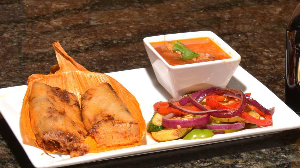 Tamales · (2) Pork with red salsa embedded in a cornmeal dough, then wrapped and steamed in cornhusks. Choice of Two sides.