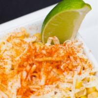 Elote · Whole kernel Corn served with a touch of sour cream, mayonnaise, lime juice, shredded cheese...