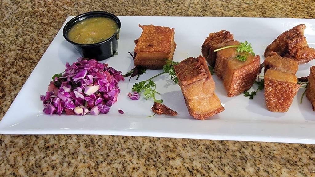 Pork Belly Bites · Slow roast and crispy pork belly with tortillas, green tomatillo salsa and guacamole