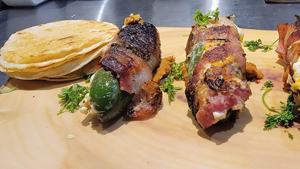 Bacon Wrapped Jalapenos · Jalapenos cooked and wrapped in bacon filled with cream cheese and corn.