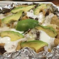 Groundbeef Nachos · filled with beans, cheese, sour cream and avocado
