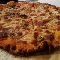 Norcina Pizza · Tomato sauce, mozzarella, fresh mushroom, and Italian sausage.