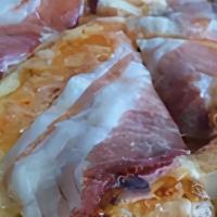 Tirolese Pizza · Tomato sauce, mozzarella, gorgonzola cheese, and bacon.