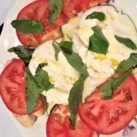 Burrata · Burrata, tomato, basil, extra virgin oil, and focaccia.