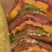 Club Sandwich · Triple-decker with turkey, ham, bacon, lettuce, tomatoes, and mayo.