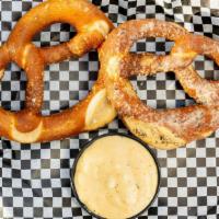 Pretzels · One soft pretzel seasoned with sea salt, jalapeno cheddar or parmesan garlic and served with...