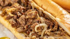 Philly Cheesesteak · Hot Buttered Cheesesteak, onion, bell pepper and swiss cheese served with waffle fries.